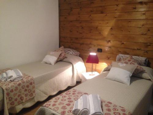 Ένα ή περισσότερα κρεβάτια σε δωμάτιο στο Maison des Challant