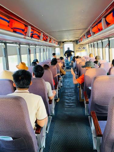 a group of people sitting on a bus at Thong Dong Homestay in Phước Lý