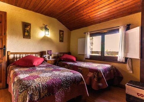 Postel nebo postele na pokoji v ubytování Masia Can Constans