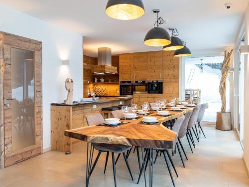 a dining room with a long wooden table and chairs at Chalet in Mauterndorf near Ski Lift in Mauterndorf
