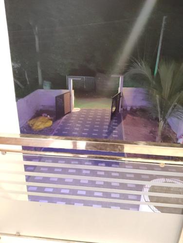 a view of a swimming pool from a window at Bluebell Shores -Cozy Stay Near Varkala Beach in Varkala