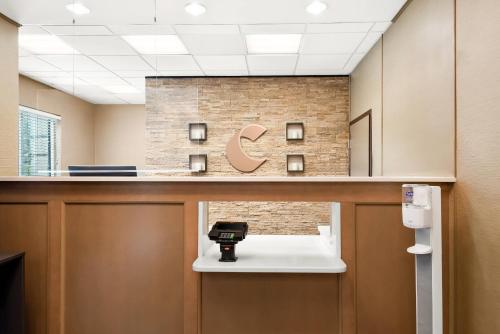an office with a c logo on the wall at Comfort Suites New Orleans East in New Orleans