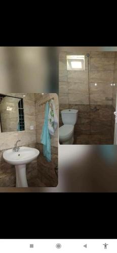 a bathroom with a toilet and a sink at Gabala,yard, house in Gabala