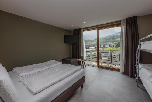 Una cama o camas en una habitación de Hotel Vittoria - Ricarica l'anima