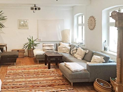 a living room with two couches and a rug at Spacious Cottage Retreat in Sonderborg-By Traum in Sønderborg