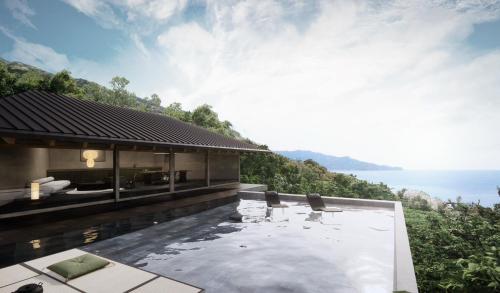a house on a hill with a swimming pool at WEAZER 西伊豆 in Izu