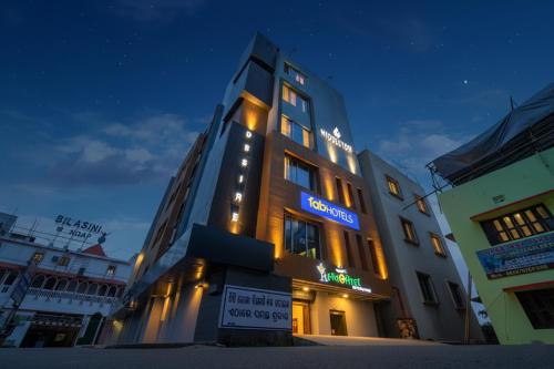 a building with a sign on it at night at FabHotel Middleton Desire - Nr Niladri Vihar Square in Bhubaneshwar