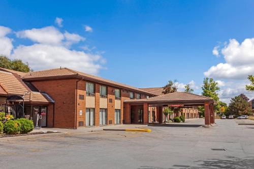 an empty parking lot in front of a building at Comfort Inn in Brantford
