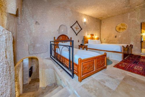a bedroom with two beds in a room at MDC Cave Hotel in Urgup