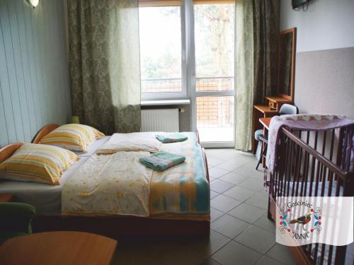 Ένα ή περισσότερα κρεβάτια σε δωμάτιο στο Holiday Home Zgorzale by Lake Radunskie