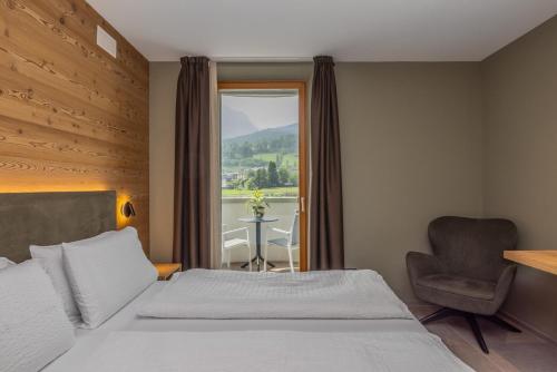 Una cama o camas en una habitación de Hotel Vittoria - Ricarica l'anima