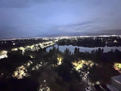 an aerial view of a river at night at Уютная квартира in Almaty