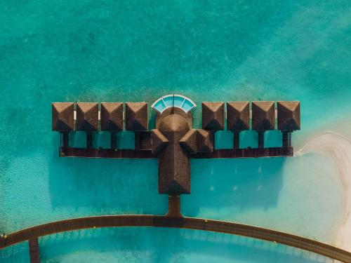 an aerial view of a cross on top of a pool at Sun Siyam Iru Veli - 24 Hours Premium All-Inclusive with Free Transfers in Dhaalu Atoll