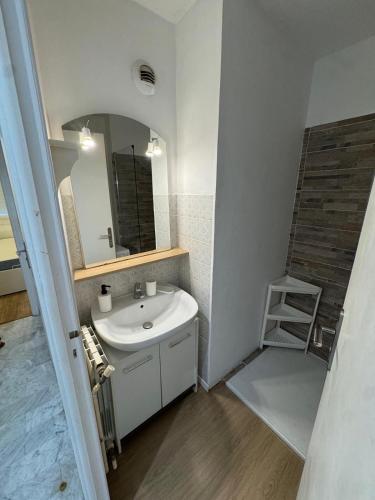 a bathroom with a sink and a mirror at Apartment in Cros de Cagnes in Cagnes-sur-Mer