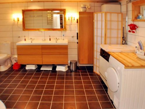 a bathroom with a sink and a toilet in it at 5 person holiday home in MARIESTAD-By Traum in Lugnås