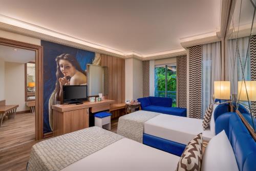 Ένα ή περισσότερα κρεβάτια σε δωμάτιο στο Botanik Hotel