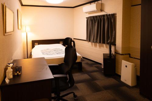Postel nebo postele na pokoji v ubytování Hotel Daiki