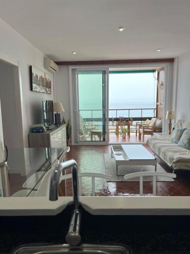 a living room with a view of the ocean at Paseo de los Castaños con vistas in Aguadulce