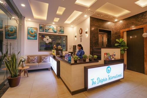 a woman standing at the counter of a salon at FabExpress Dolphin International - Nr IGI Airport New Delhi in New Delhi