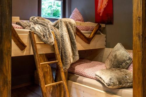 a couple of bunk beds in a room at Hotel Schmausemühle in Gondershausen