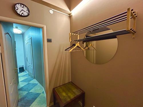 a room with a bunk bed and a clock on the wall at Traditional Narva House in Narva