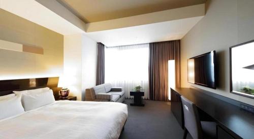 Hotel Riverge Akebonoにあるベッド