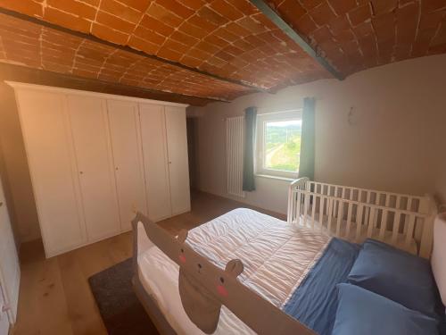 Ένα ή περισσότερα κρεβάτια σε δωμάτιο στο Casale Ohana