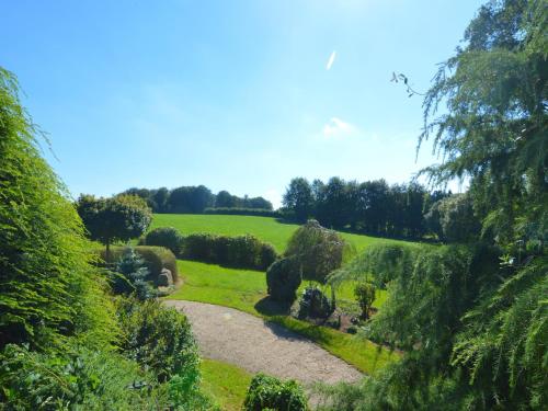 a view of a garden from the top of a hill at Moderscheid Cottage with Spa in Amblève