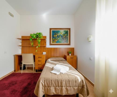 Postel nebo postele na pokoji v ubytování Nazareth Residence