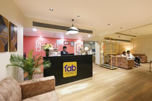 a reception area of a jobolis office with people sitting at FabExpress La Serene NFC in New Delhi
