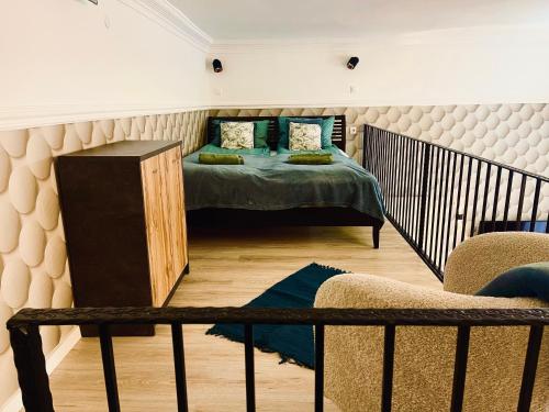 Ένα ή περισσότερα κρεβάτια σε δωμάτιο στο Brookforest Belvárosi 3 Apartman