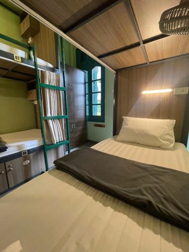 a bedroom with a bunk bed and a bunk bed at Hanoi EcoStay 2 hostel in Hanoi
