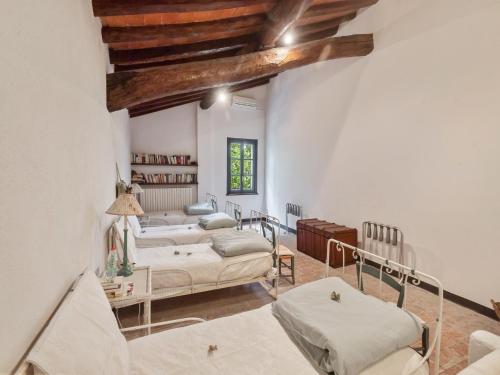 a living room with two beds and a couch at Villa in Lombardy near Po River in Stagno Lombardo
