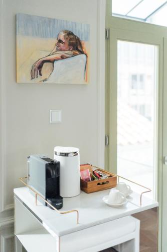 a white table with a microwave and a box on it at Nosteo in Athens