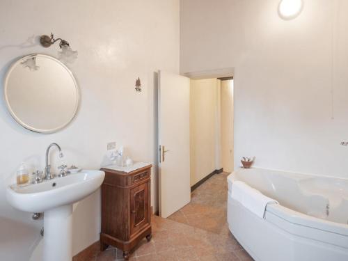 a white bathroom with a tub and a sink and a bath tub at Villa in Lombardy near Po River in Stagno Lombardo