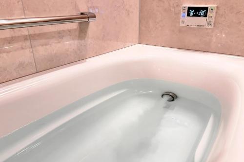 Ванная комната в BOND COMFORT HOTEL MIYAJIMAGUCHI - Vacation STAY 79234v
