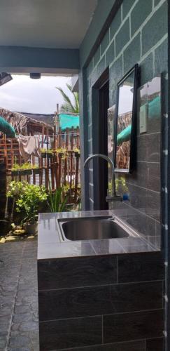 a kitchen with a sink in a room at Kua's Pad Batangas Tent in Calatagan