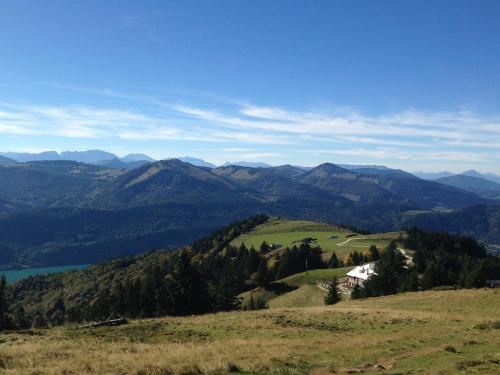 a view of a mountain with a house on a hill at Abis Ferienwohnung Salzkammergut in Strobl