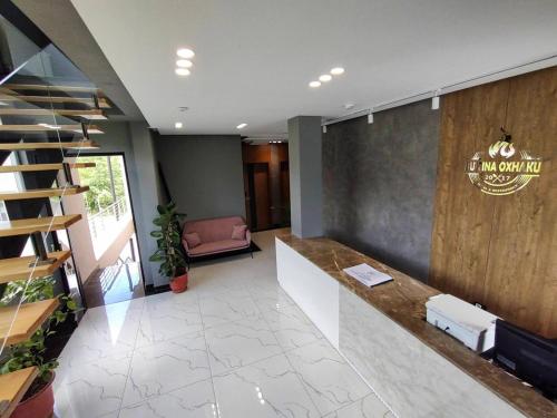 an office with a lobby with a reception desk at Bujtina Oxhaku in Peshkopi