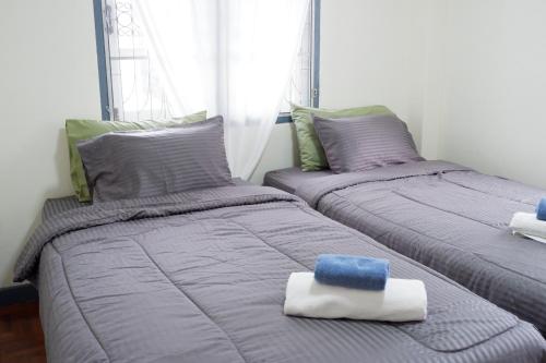 Katil atau katil-katil dalam bilik di Autumn breeze house
