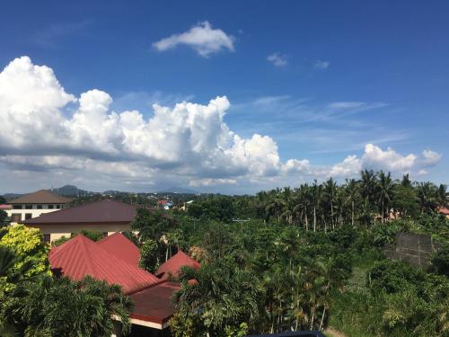 a view of a resort with trees and buildings at Rangya Hotel in Tagaytay