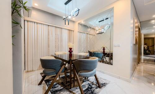 a dining room with a table and chairs at Sabolak Suite-Oak 2 Bedroom in Lagos