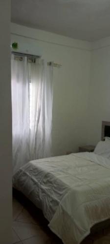Кровать или кровати в номере La Résidence Hoteliere la Maison Blanche Afanayo