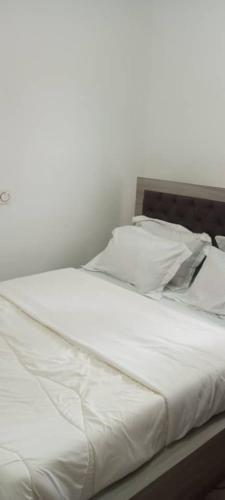 Кровать или кровати в номере La Résidence Hoteliere la Maison Blanche Afanayo