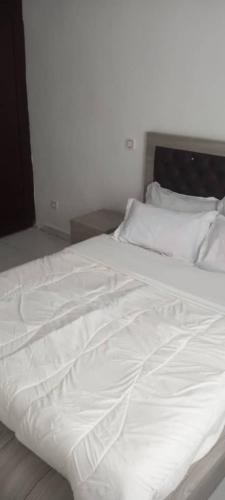 Кровать или кровати в номере La Résidence Hoteliere la Maison Blanche Afanayo