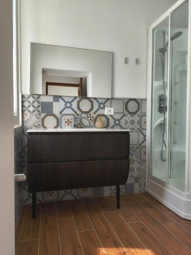 a bathroom with a sink and a shower at Girasole Casa Vacanza in Stradella