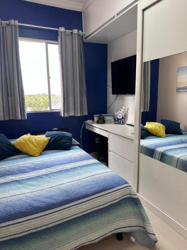 En eller flere senge i et værelse på Apartamento