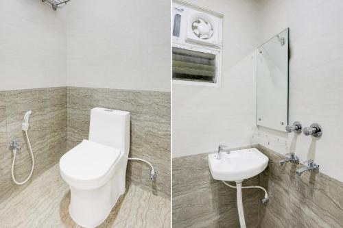 a bathroom with a toilet and a sink at Super Collection O Manikarnika Sahi Near Jagannath Temple in Puri