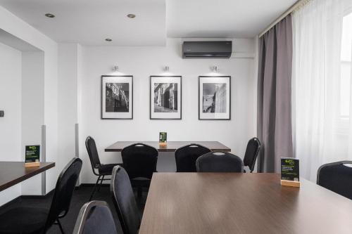 a meeting room with a table and chairs at B&B HOTEL Bytom in Bytom