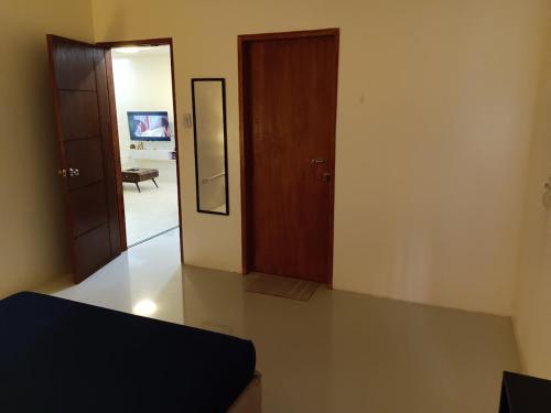 a bedroom with a door and a mirror and a room at Laika the Beagle's Home away from Home - Clark in Angeles